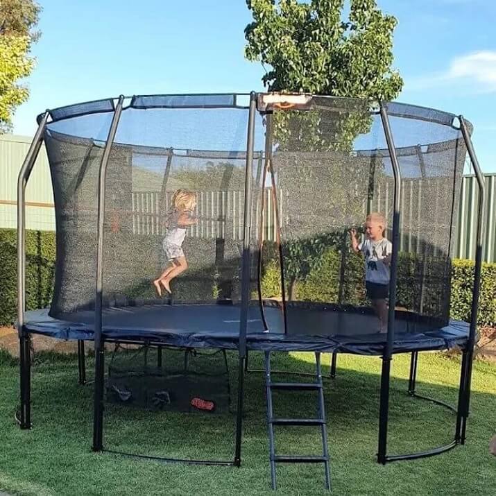 Two Child Play In Trampoline